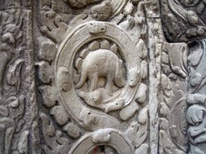 This picture of a buddist temple had numerous cavings of animals, one of which was a dinosaur.